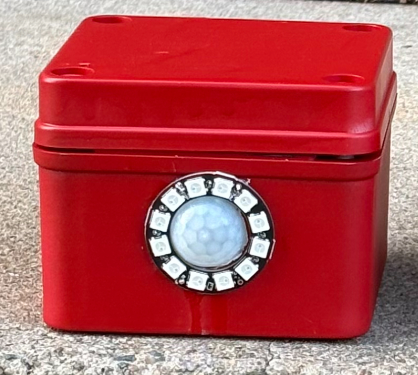 A Scare Box with its LED ring lit in the dark